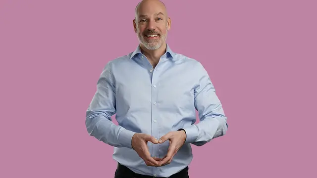 Medarbetare på Euro Accident ler stort och formar ett hjärta med händerna